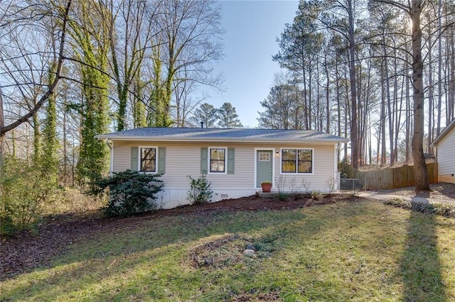 ranch-style home with a front lawn