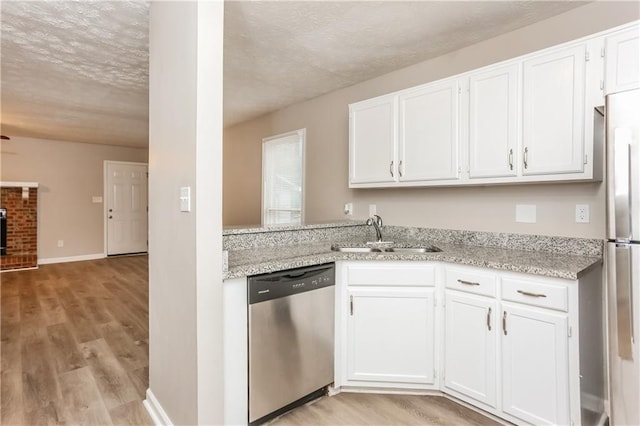 4893 Autumn Cir, Stone Mountain, GA 30088 - kitchen featuring light wood-style floors, white cabinetry, stainless steel appliances, and a sink