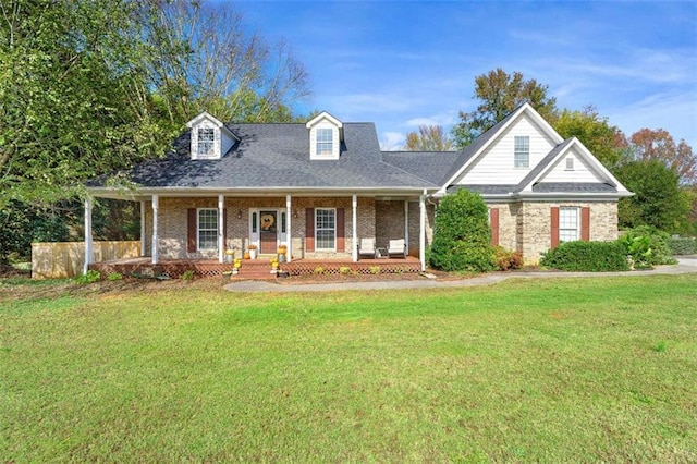 view of front of home featuring covered porch and a front yard