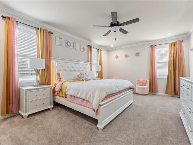 bedroom featuring ornamental molding, a ceiling fan, and light colored carpet