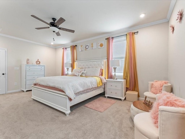 bedroom with carpet floors, crown molding, baseboards, and a ceiling fan