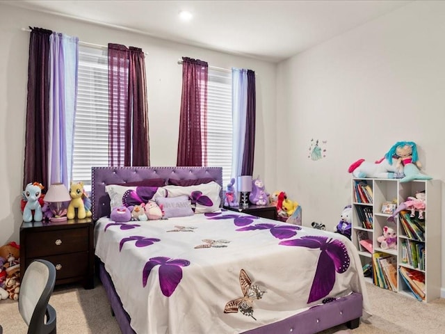 carpeted bedroom with multiple windows