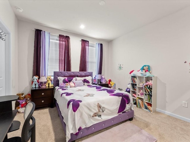 carpeted bedroom with baseboards