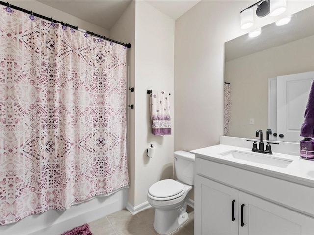 full bath featuring toilet, shower / tub combo, vanity, baseboards, and tile patterned floors