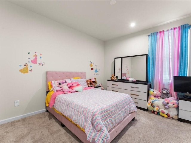 carpeted bedroom featuring baseboards