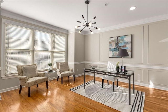 office featuring light wood-type flooring, a chandelier, crown molding, and a decorative wall