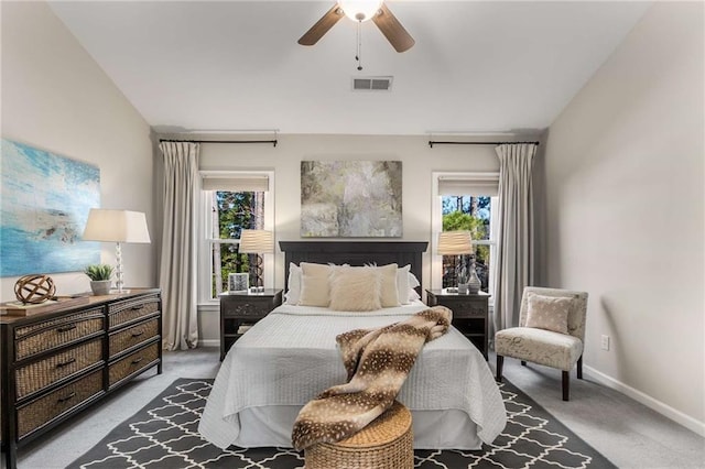 bedroom featuring multiple windows, visible vents, and carpet floors