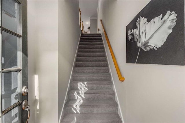 stairs featuring baseboards