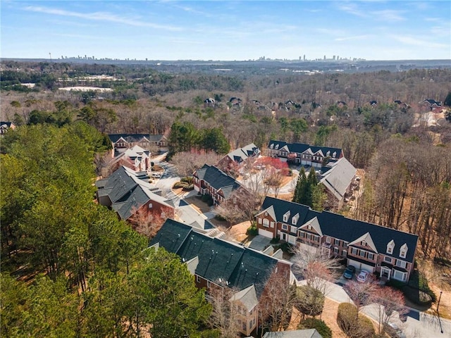 aerial view featuring a wooded view
