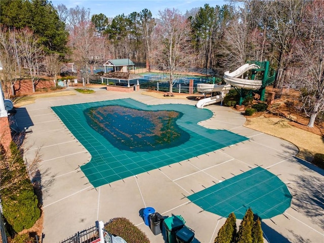 view of pool with a patio area and fence