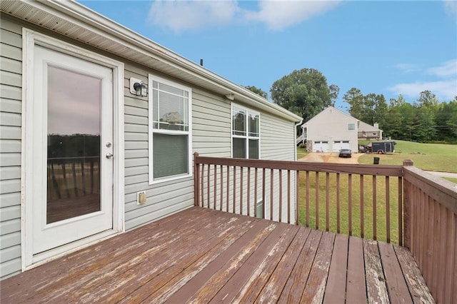 wooden terrace with a yard