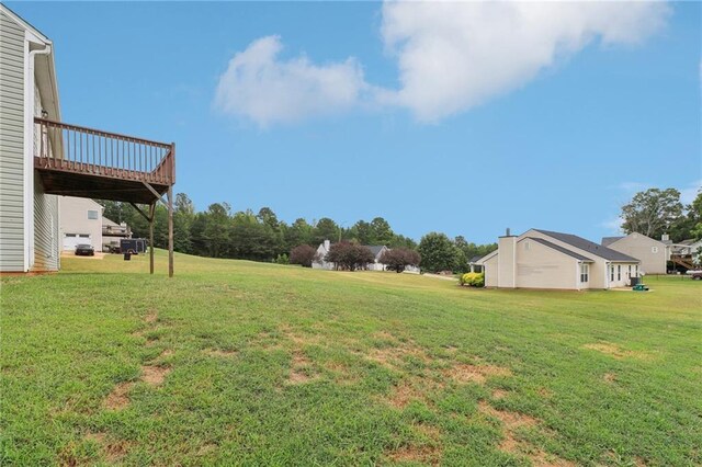 view of yard with a wooden deck