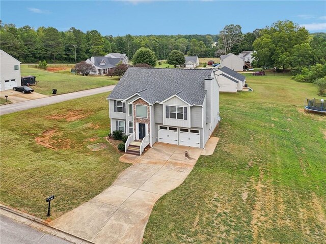 birds eye view of property featuring a view of trees