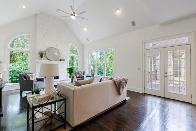 living room with high vaulted ceiling, dark wood-style flooring, a fireplace, visible vents, and french doors