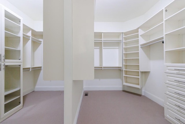 walk in closet with carpet floors and visible vents