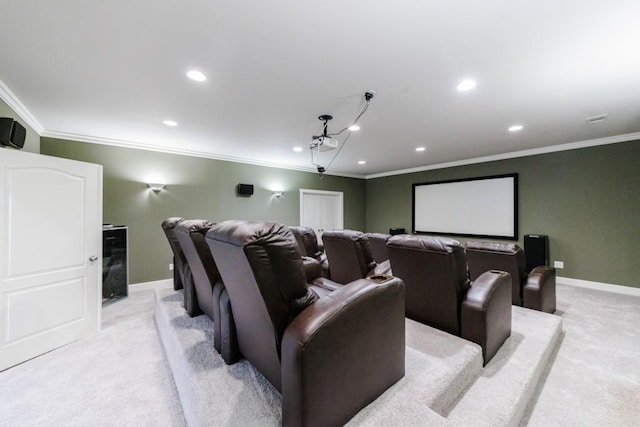 cinema featuring light carpet, baseboards, and crown molding