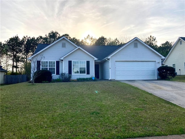 single story home with a yard and a garage