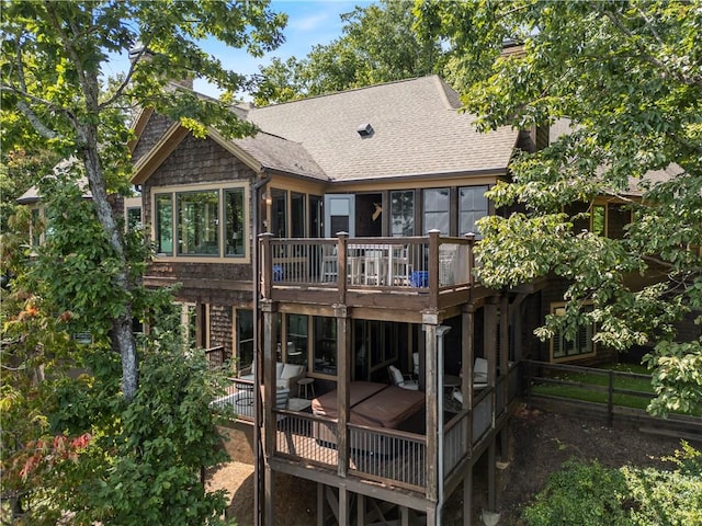 back of house featuring a deck