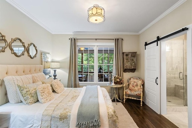 bedroom with crown molding, a barn door, dark wood-type flooring, and connected bathroom