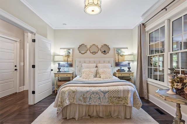 bedroom with ornamental molding and dark hardwood / wood-style floors