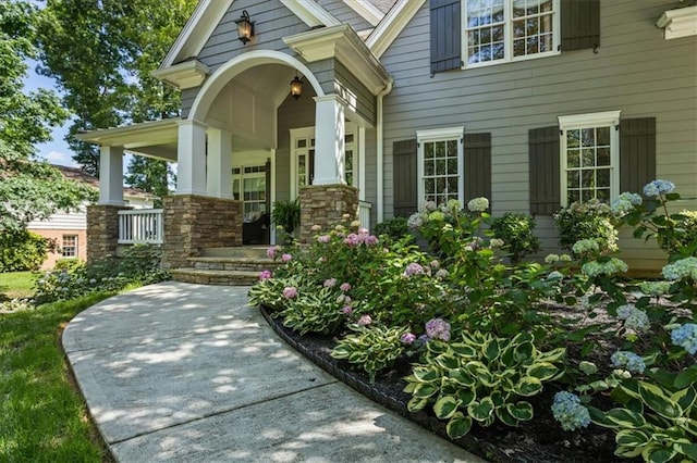 doorway to property featuring a porch