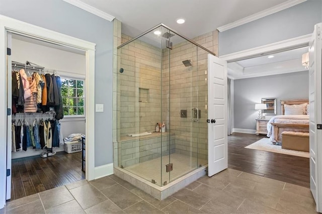 bathroom with ornamental molding, tile patterned floors, and walk in shower