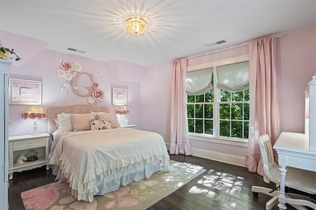 bedroom with dark wood-type flooring