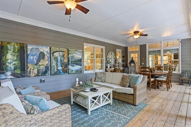 sunroom / solarium with ceiling fan