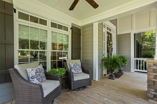 wooden deck featuring ceiling fan and covered porch