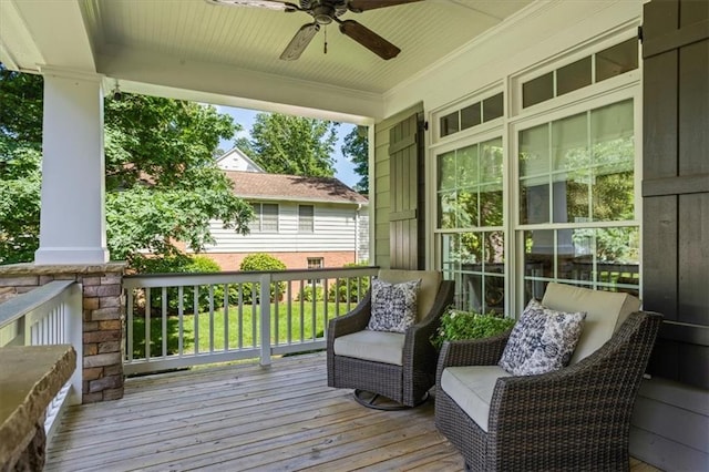 wooden terrace with ceiling fan and a porch