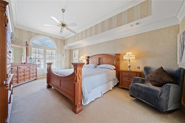 carpeted bedroom with crown molding and ceiling fan