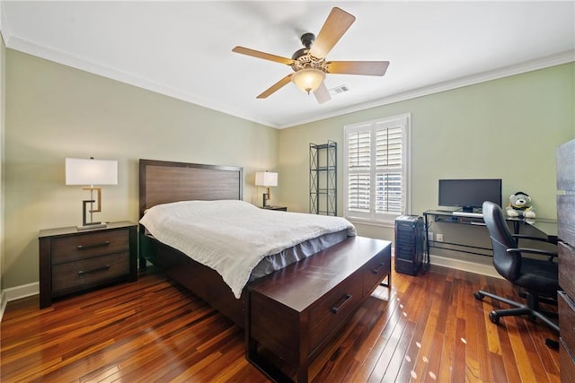 bedroom featuring crown molding, dark wood-type flooring, and ceiling fan