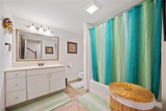 full bathroom with vanity, toilet, and shower / bath combo with shower curtain