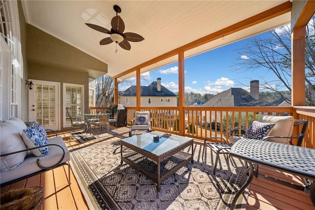 wooden deck with ceiling fan, outdoor lounge area, and a mountain view