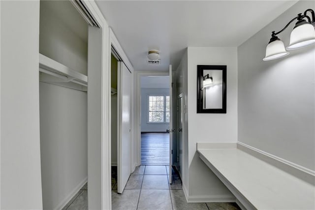 hallway with light tile patterned floors