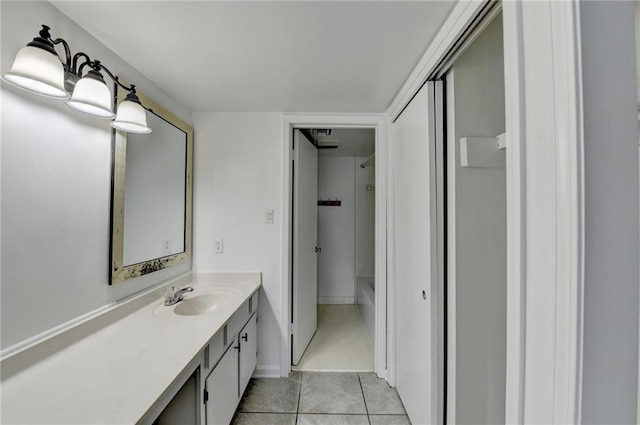 bathroom with tile patterned floors and vanity