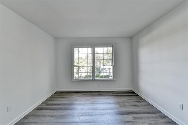 spare room with hardwood / wood-style flooring