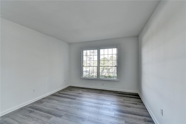 unfurnished room featuring light hardwood / wood-style flooring
