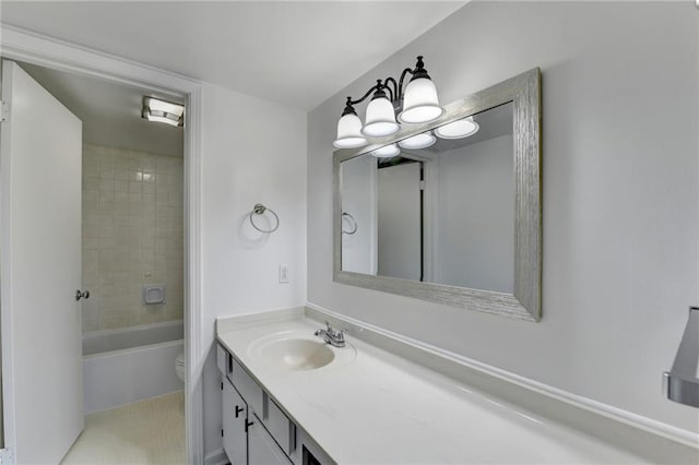 full bathroom featuring vanity, toilet, and tiled shower / bath combo