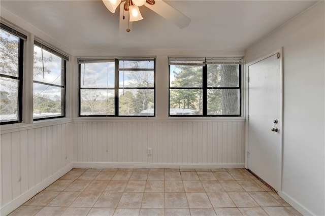 unfurnished room featuring ceiling fan and light tile patterned floors