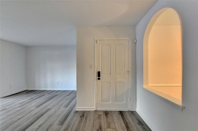 empty room with light hardwood / wood-style floors