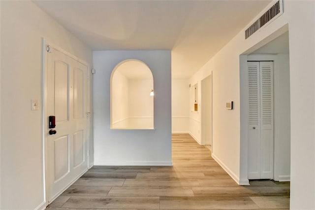 hallway with light wood-type flooring