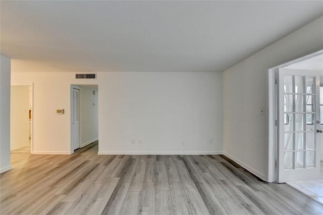 unfurnished room featuring light wood-type flooring