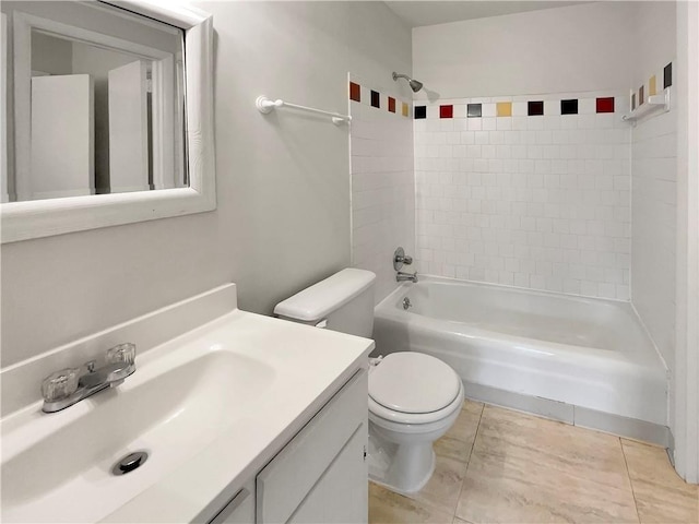 full bathroom with tile patterned flooring, toilet, vanity, and tiled shower / bath