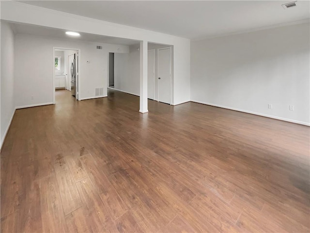 spare room featuring dark hardwood / wood-style floors