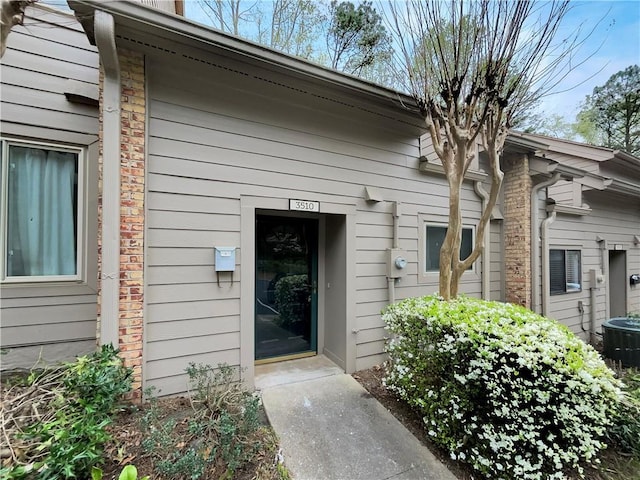 doorway to property with cooling unit