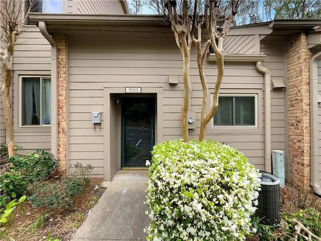 entrance to property featuring central AC unit