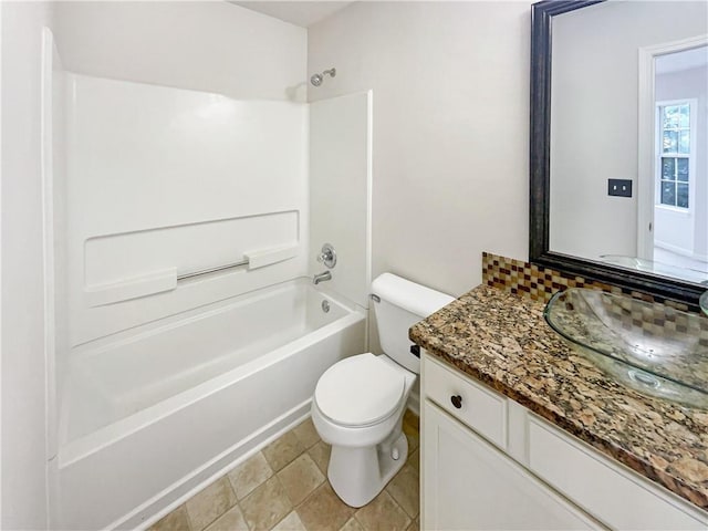 full bathroom featuring shower / bath combination, vanity, and toilet