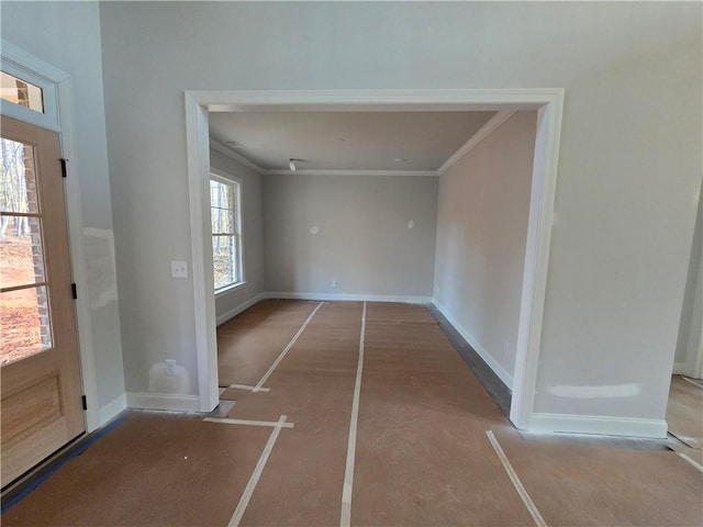 unfurnished dining area with crown molding