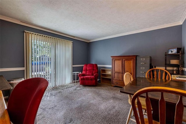 carpeted dining area with ornamental molding and a textured ceiling